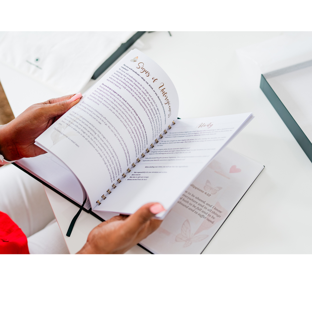 Flip through image of a devotional with vellum butterfly overlay and gold coil binding.